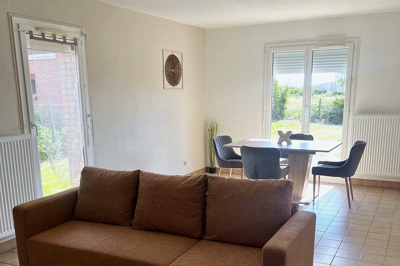 Living and dining area with doors onto the garden