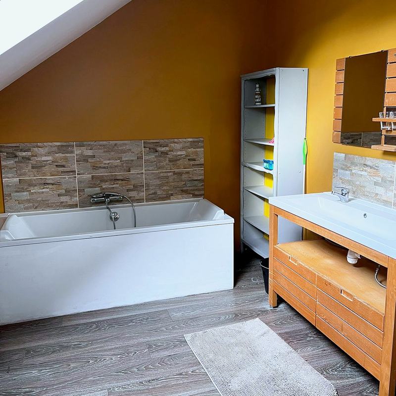 Bathroom with a bath and a wide washbasin